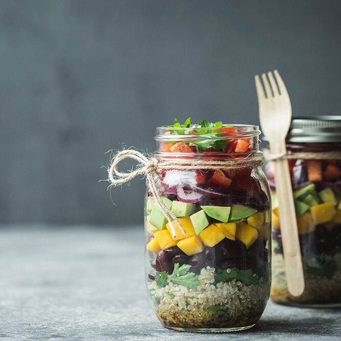 Healthy homemade salad in mason jar with quinoa and vegetables. Healthy food, clean eating, diet and detox.